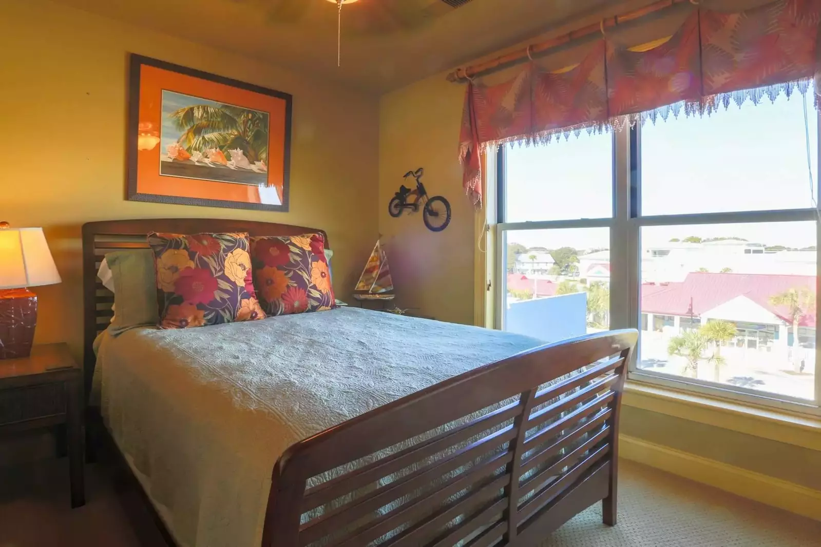 Guests love the tropical colors and bamboo-themed decor in this queen sized guest bedroom.