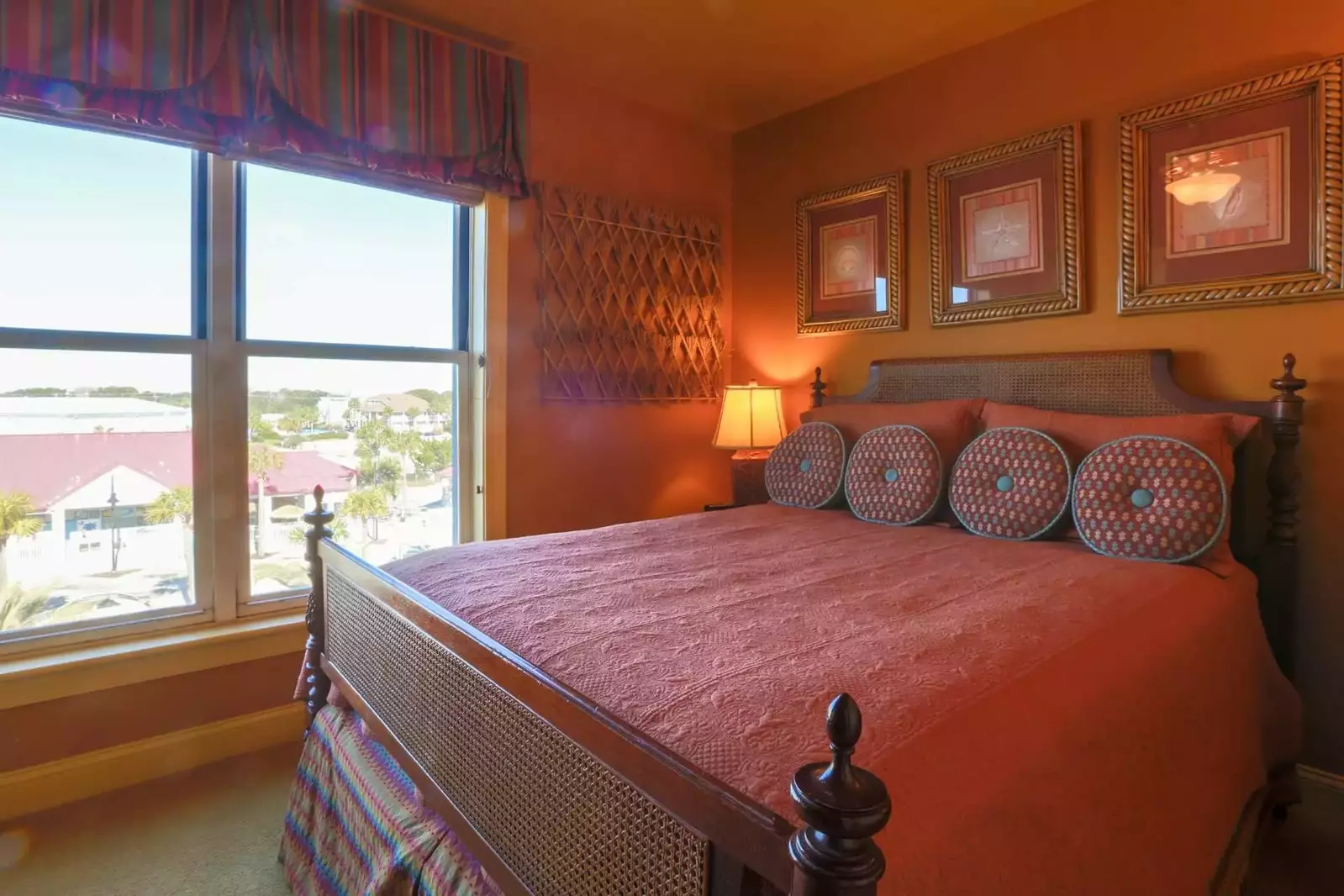 This guest bedroom with a queen-sized bed overlooks the street side of the building.