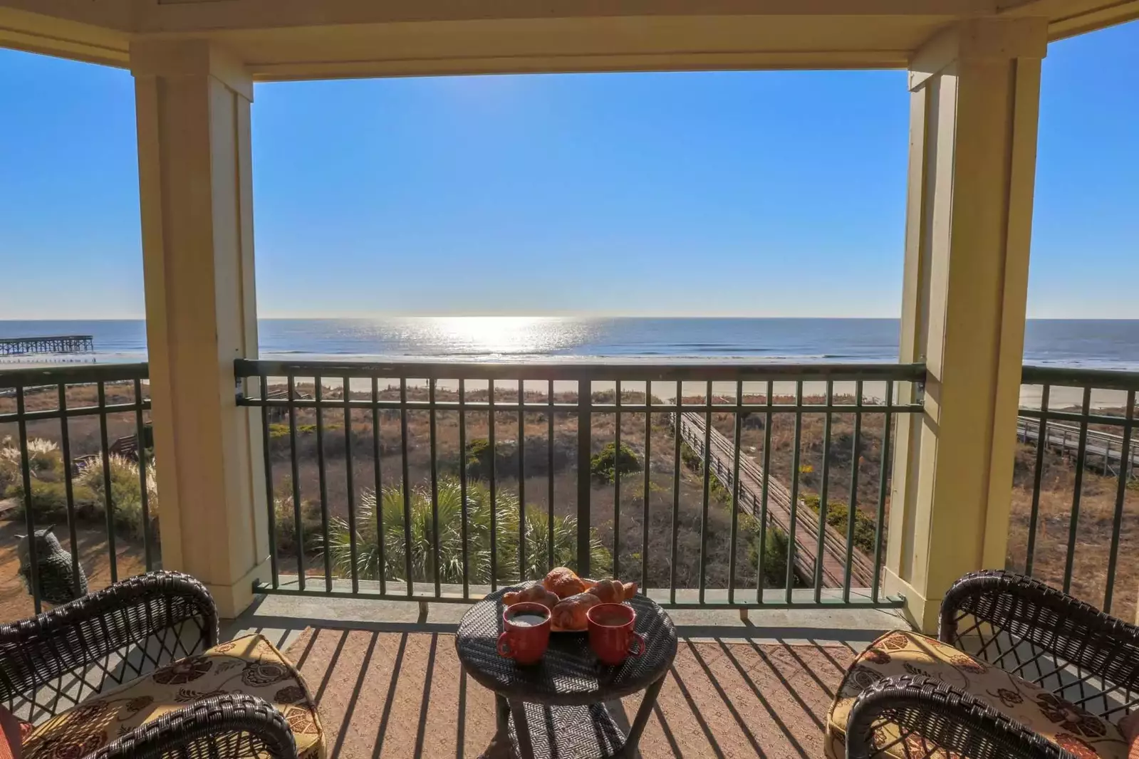 Guests will enjoy the building's private boardwalk beach access.