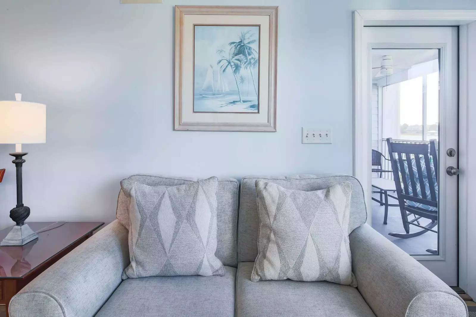 You may access the screened porch from the living room.