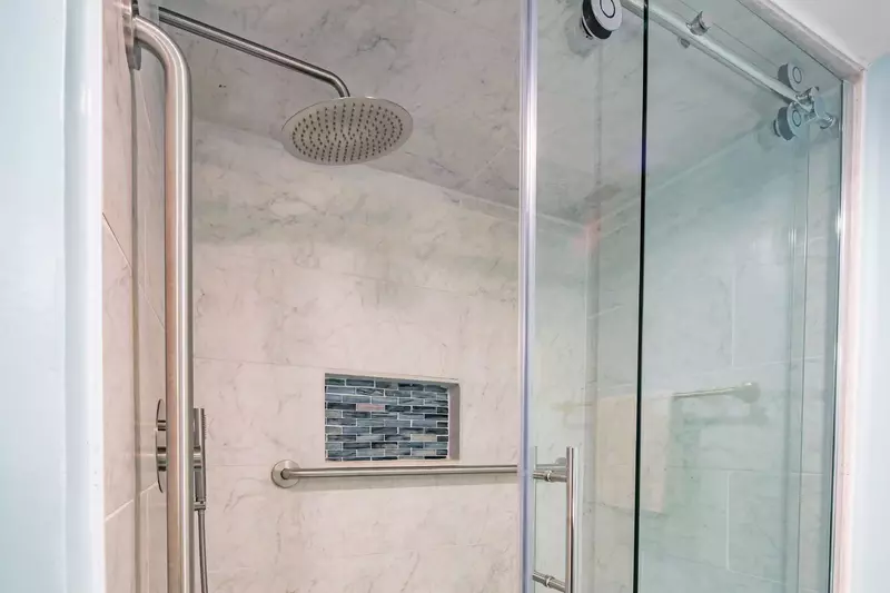 The master bathroom also has a beautifully tiled walk-in shower.