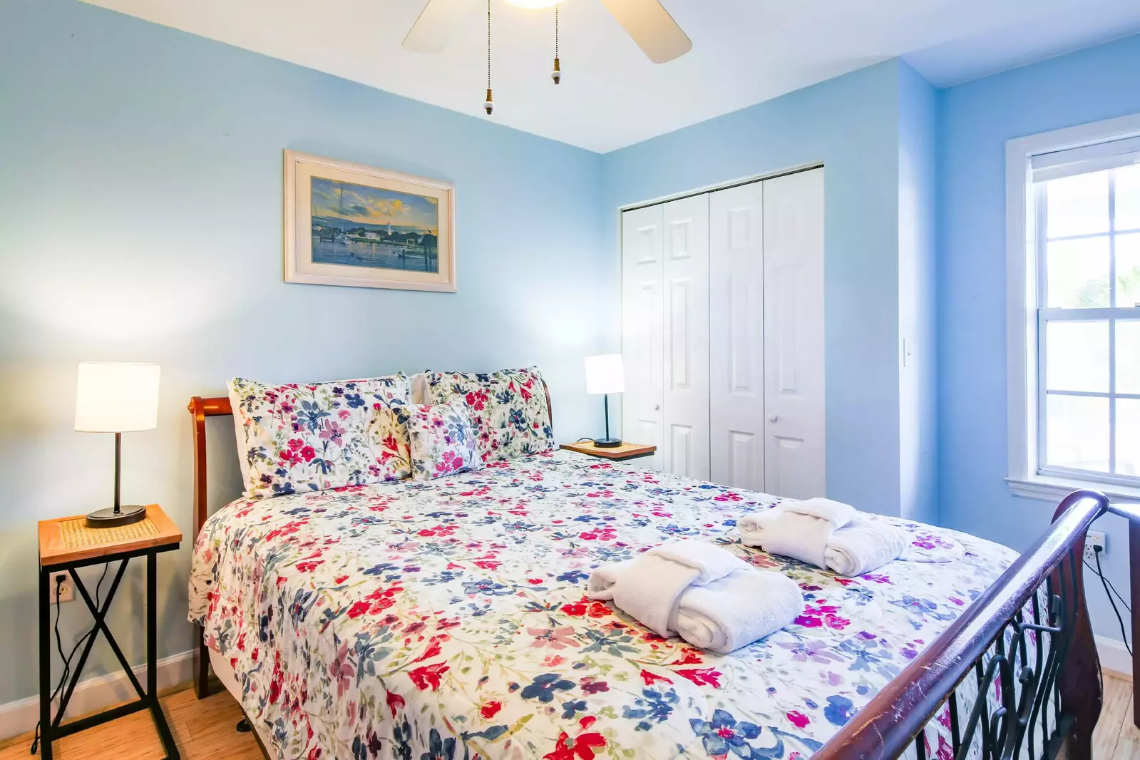 The guest suite features a queen bed and night stands with reading lamps.