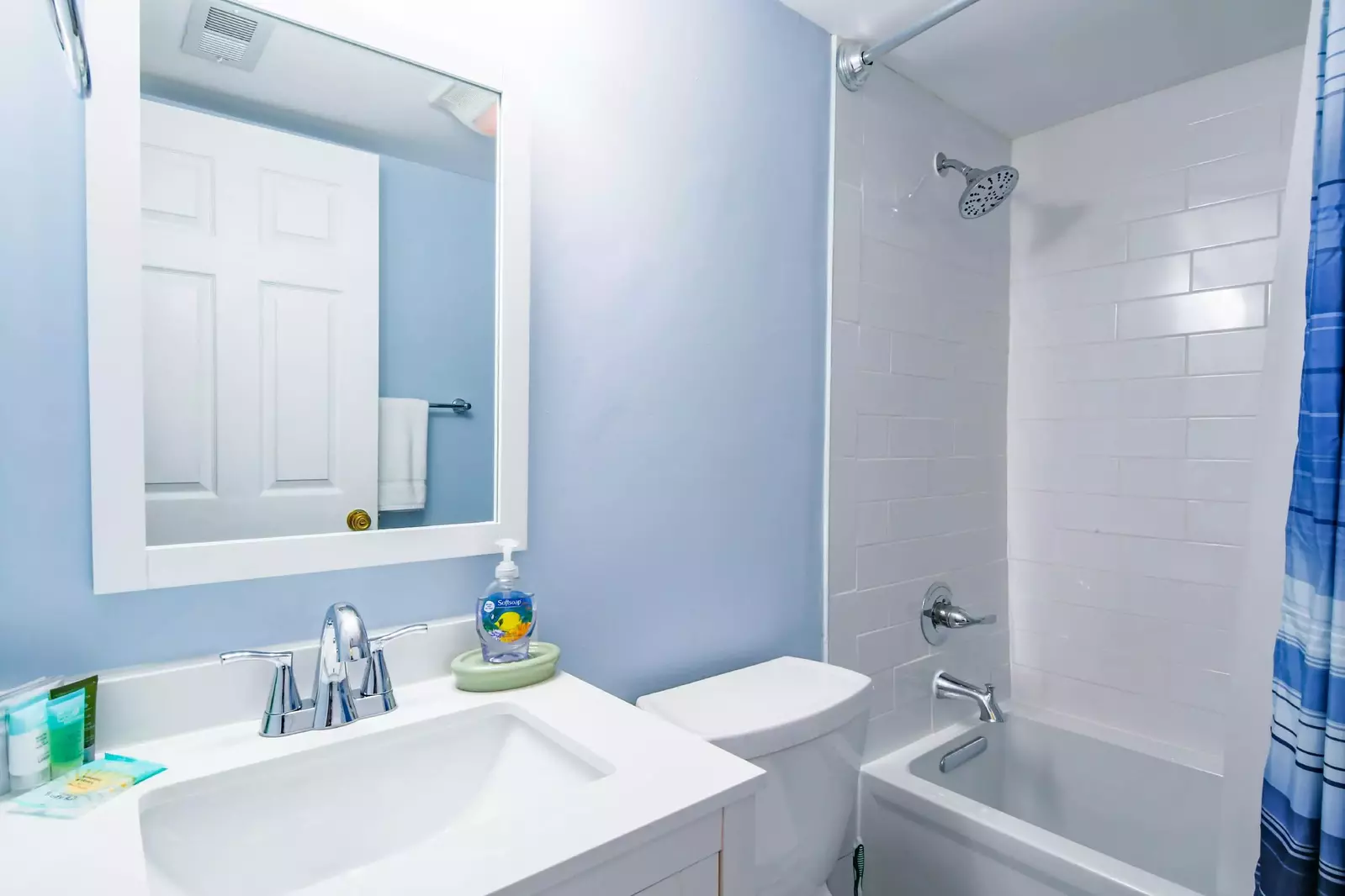 This recently renovated guest bathroom features a new vanity and shower/tub combo.