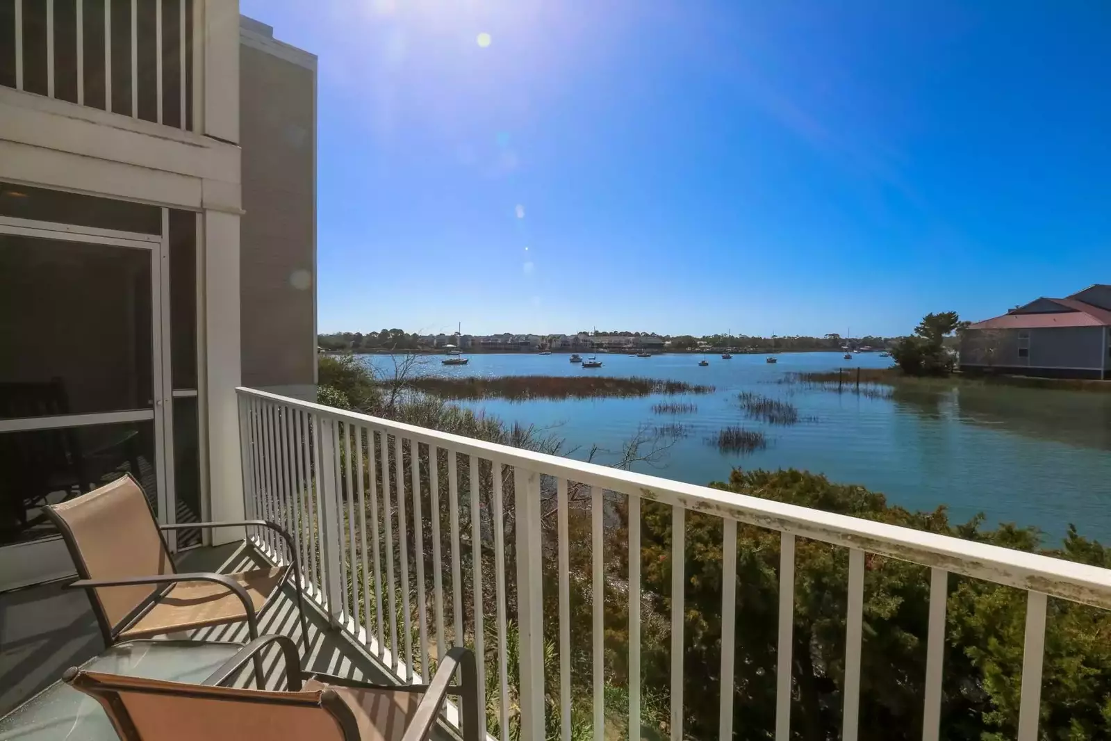 The condo features both an open patio and screened-in porch
