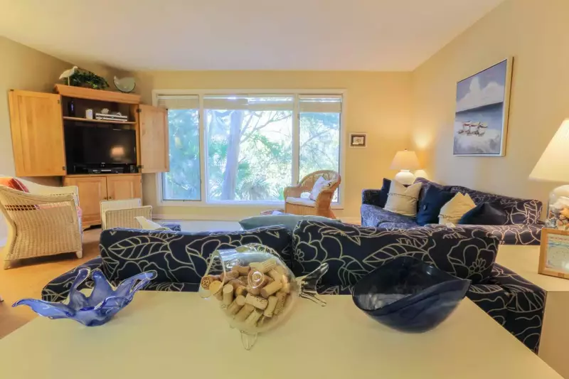 Relax and unwind in our natural light filled & beachy themed living room.