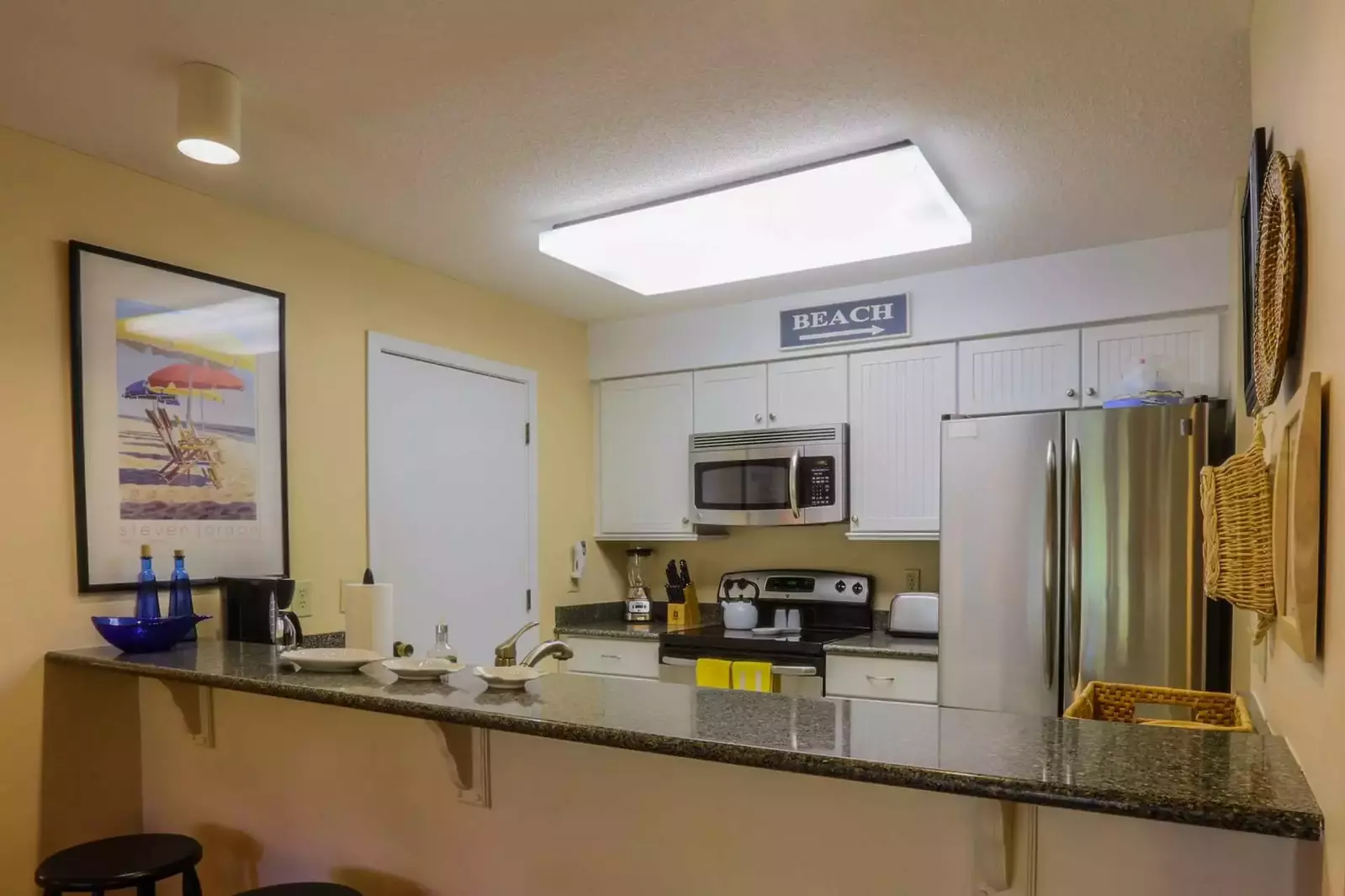 You'll find a beach cart, beach umbrella and beach chairs in the kitchen pantry closet.