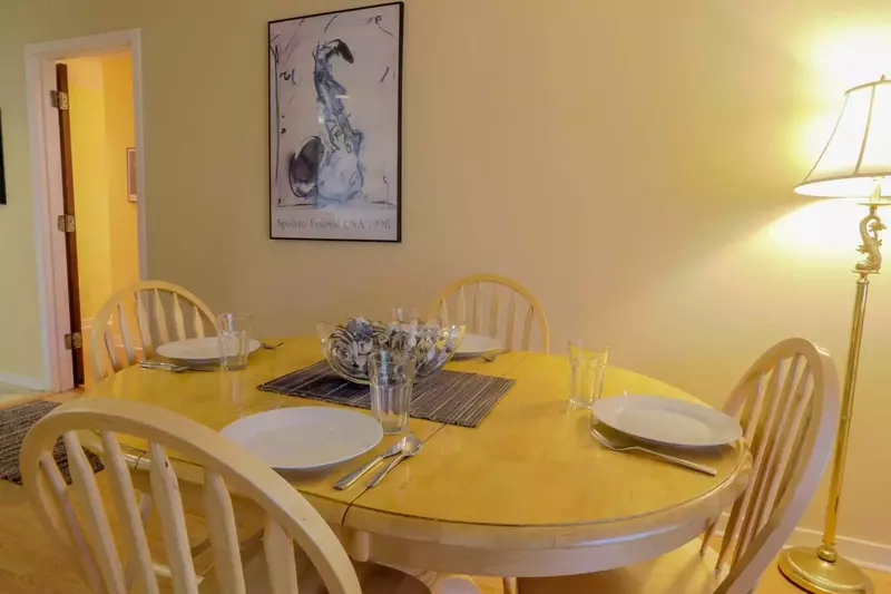 The dining room table comfortably seat 4 people.  There is additional seating for 4 people at the kitchen's bar.