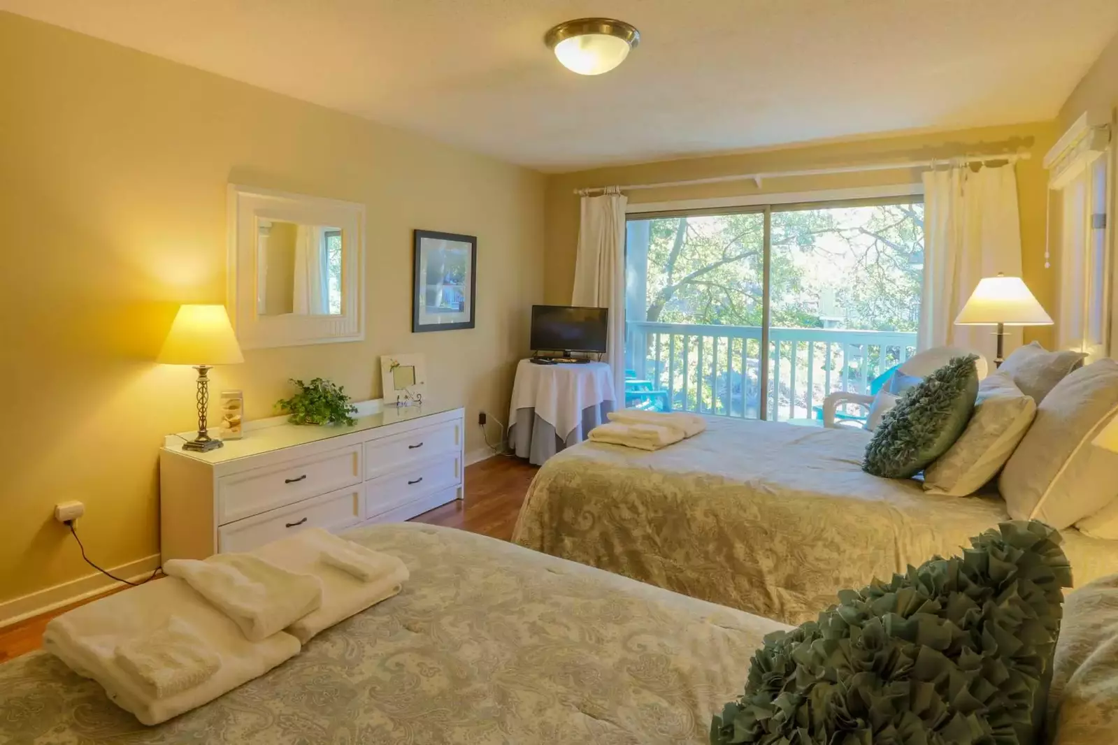 Each bedroom contains its own dresser, night stands and TV.