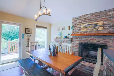 The front door opens into the dining room, living room and kitchen areas.