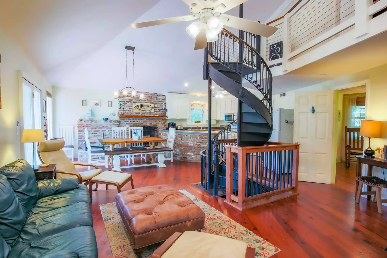 The home is designed around a central, spiral staircase the connects all 3 levels of the home.