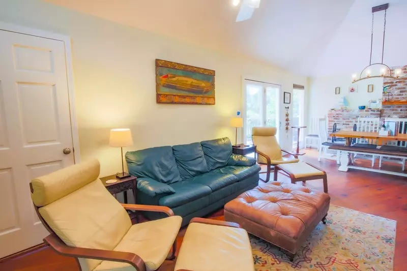 The door on the left of the photo leads to a sunny guest bedroom.