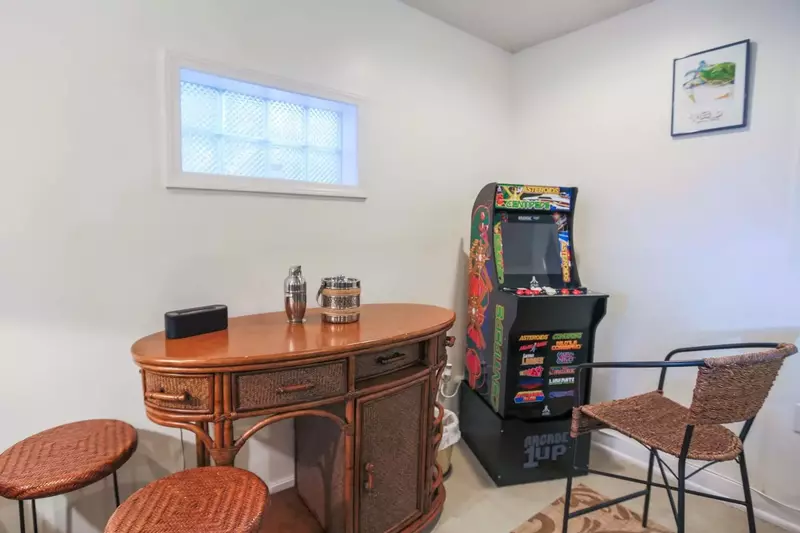 Best of all, there's an arcade video game tucked away in the corner of the basement.