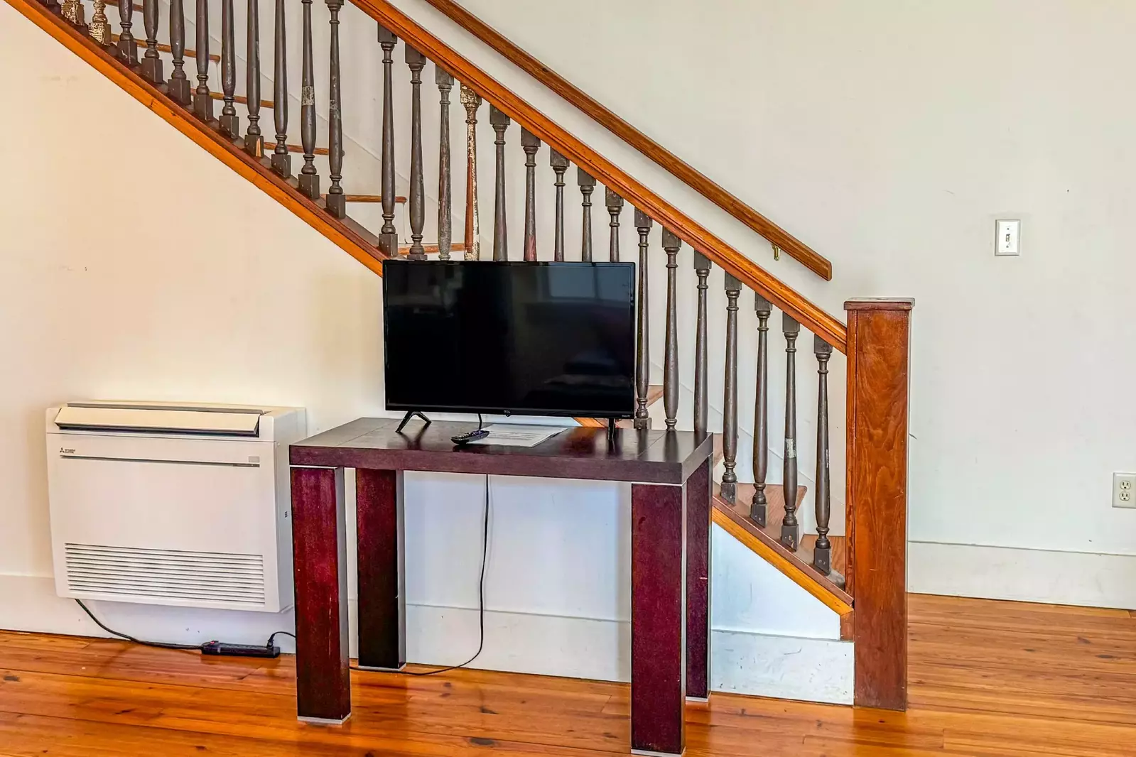 This stairwell leads to both of the bedrooms and bathrooms on the second floor.
