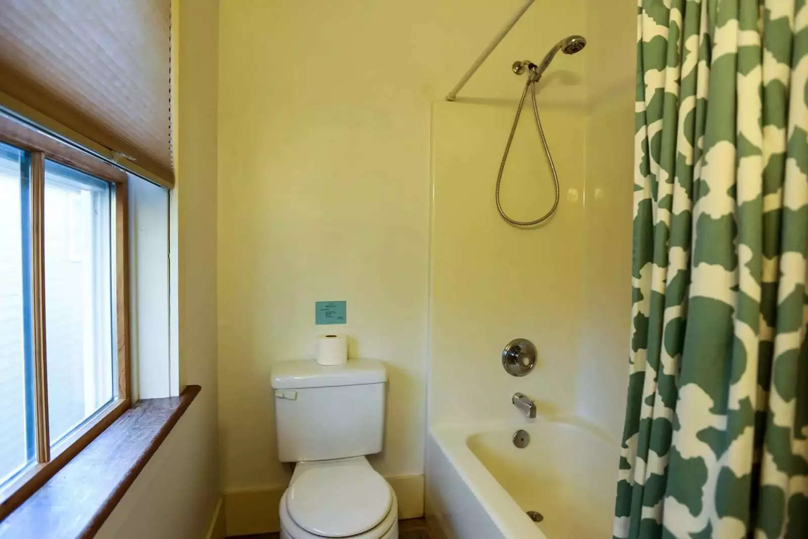 This en suite bathroom has a shower/tub combo.