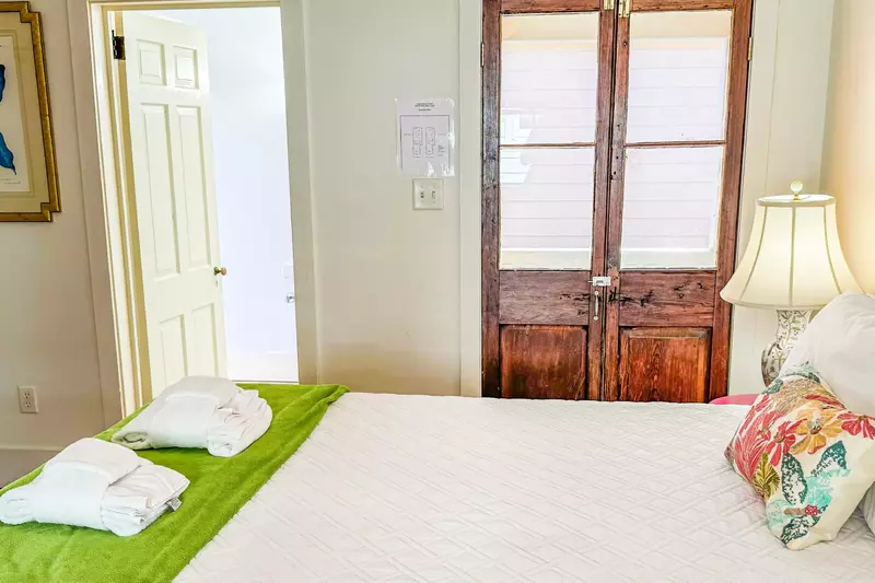 This bedroom also features an en suite bathroom and access to a private piazza.