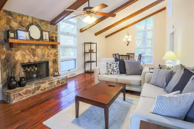 You'll love the gorgeous floors and wood beamed ceiling in the Oak Woods Cottage living room and dining room.