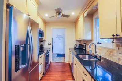 There's plenty of room in the kitchen for you and your guests to prepare & enjoy your meals.
