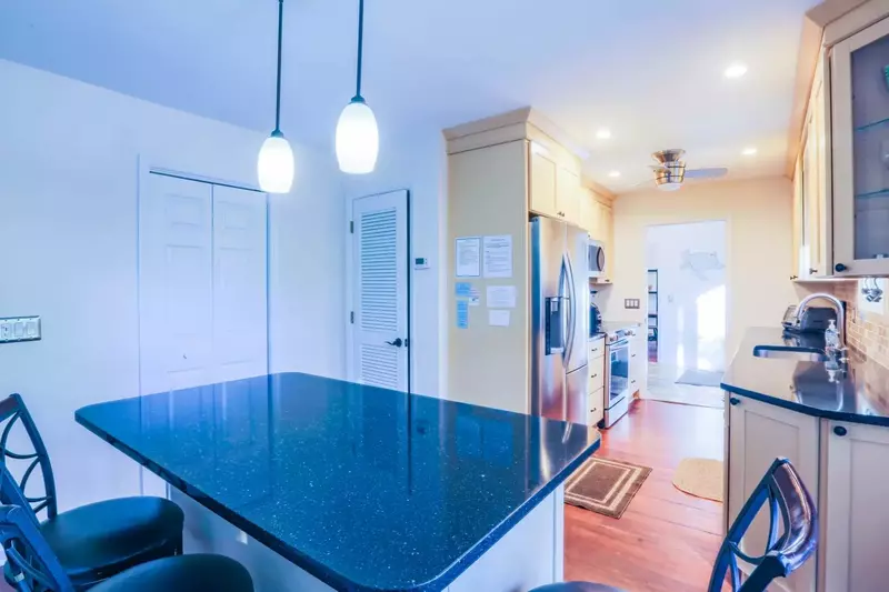 There are 4 stools at the kitchen island for additional seating.