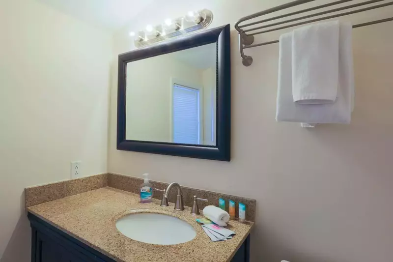 The en suite bathroom for the master suite features a spacious vanity.