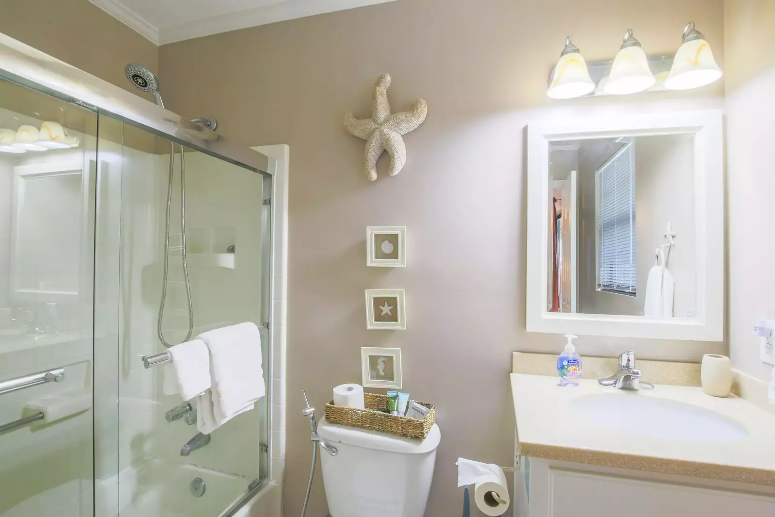 The en-suite bathroom in the master bedroom has a shower & tub combo, corian countertops and storage area for your toiletry kit.