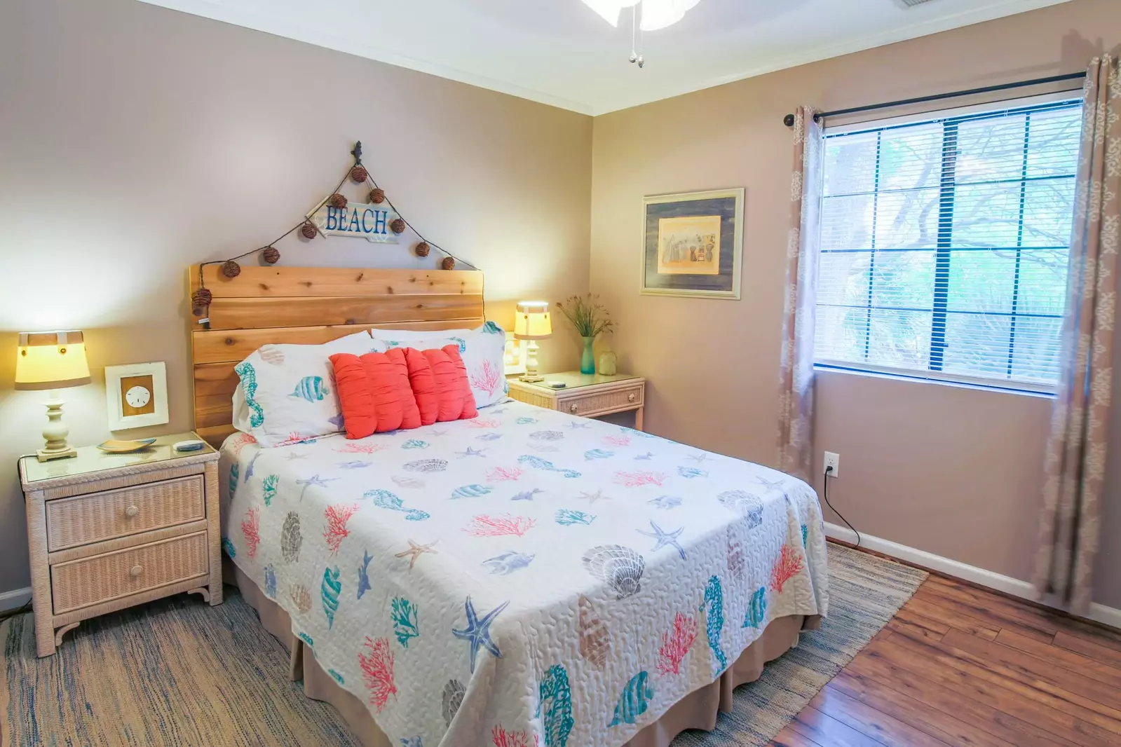 This guest bedroom features a queen bed and reading lamps on the nightstands.
