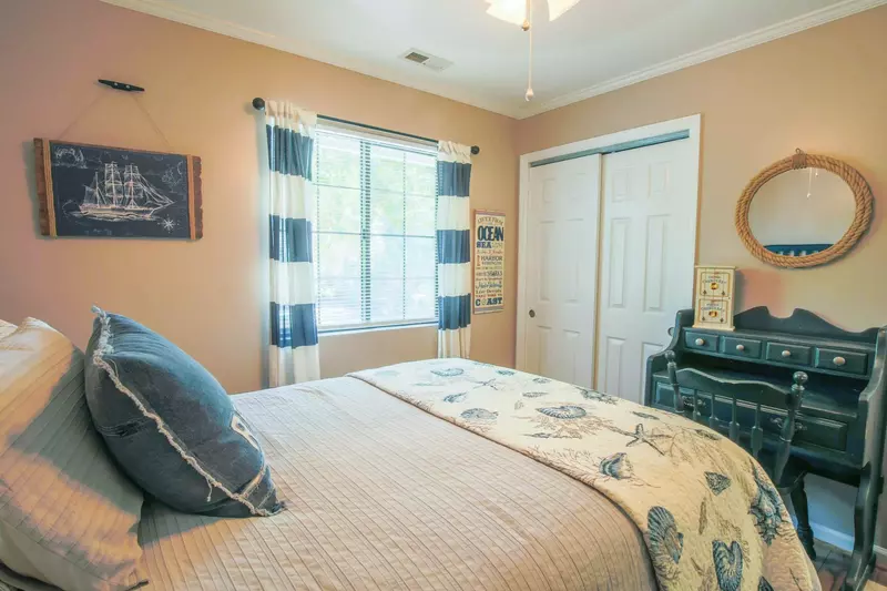 This guest room also features a small desk or workspace.