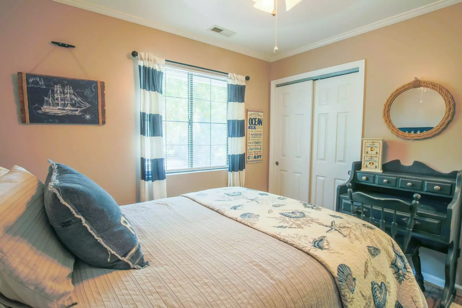 This guest room also features a small desk or workspace.