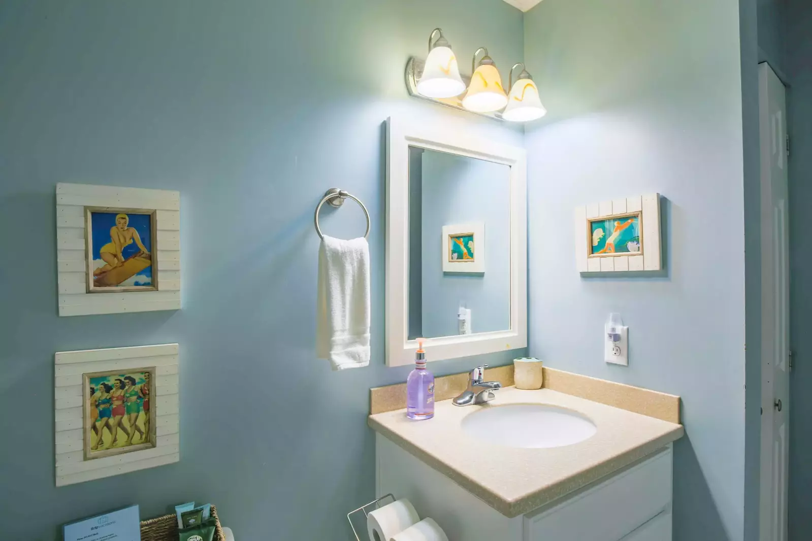 The guest bathroom is located off the hallway near the guest bedrooms and living room.