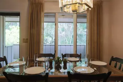 When you enter the home, you'll find this spacious dining table that seats up to 8.