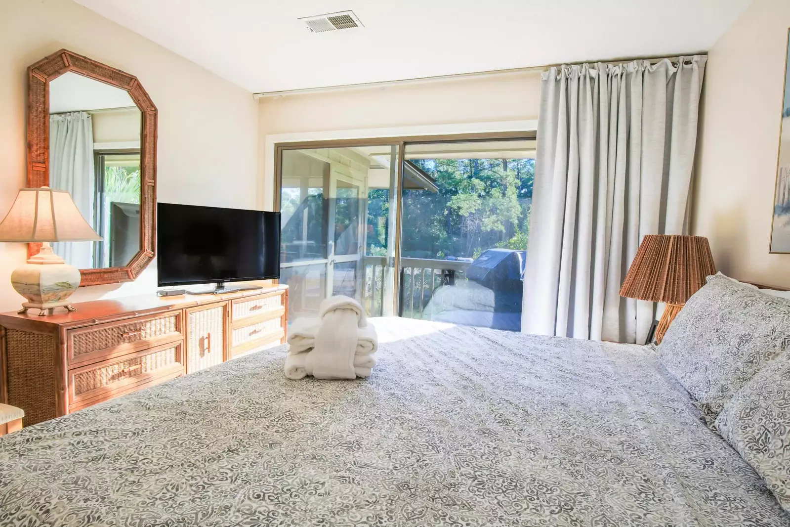 The master suite also features a dresser and streaming TV.