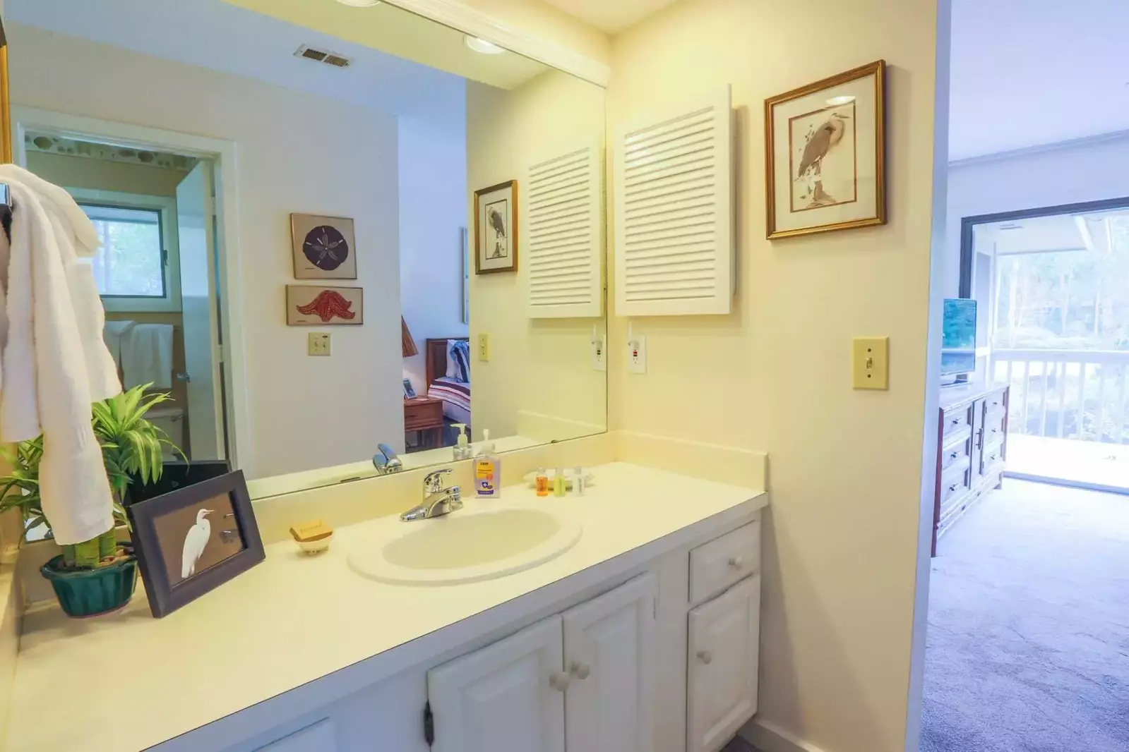 Enjoy the artwork in this freshly repainted bathroom.
