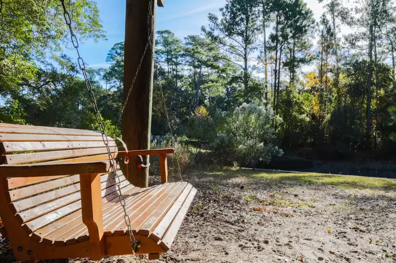 Relax on the swing-chair and watch the herons stalk fish in the inlet!