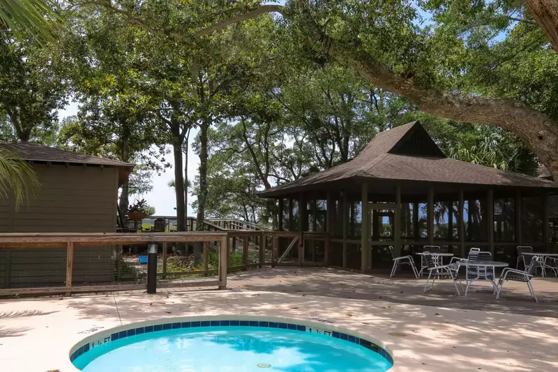 The Inlet Cove community pool also has a kiddie pool, boat dock & screened-in gathering space.