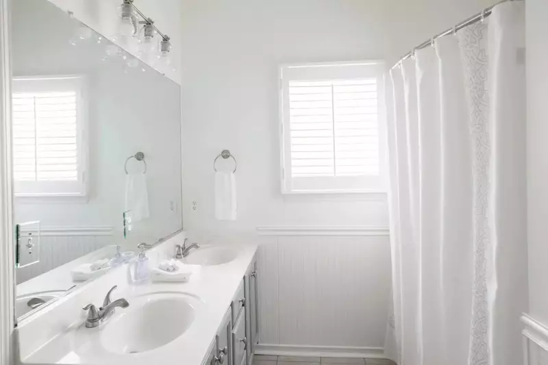 The master bath features dual vanities and a tub/shower combination.