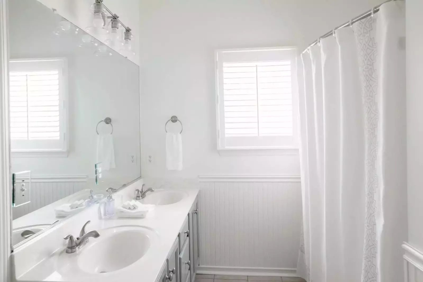 The master bath features dual vanities and a tub/shower combination.