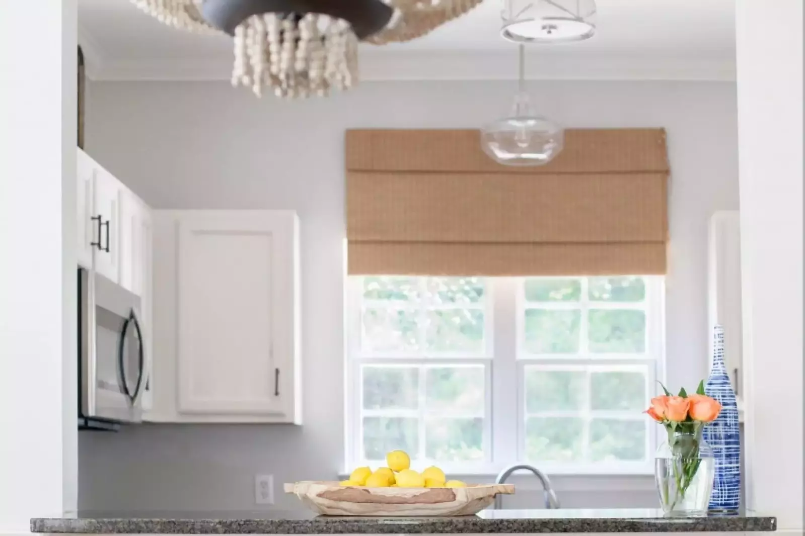 The breakfast bar connects the kitchen to the dining area.