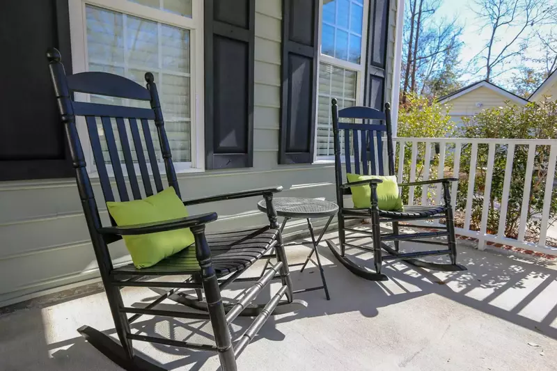 Two rocking chairs on the front porch welcome you home to Falling Moss.