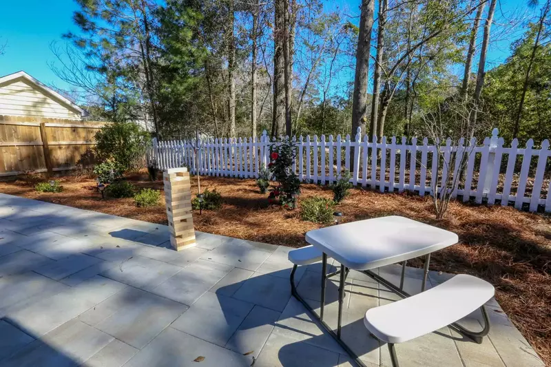 We also have a kids' picnic table and giant falling timbers game in the fenced backyard.