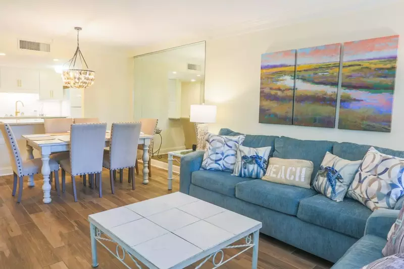 We are swooning over this gorgeous artwork above the spacious sofa.