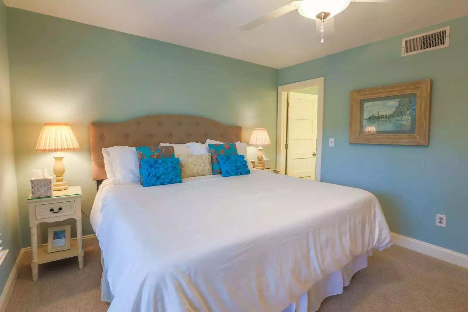 The door in this photo leads to the en suite bathroom for the master suite.