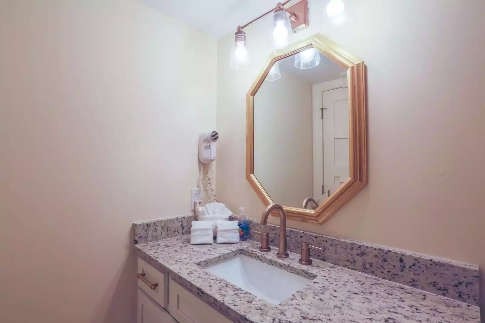There's plenty of space to get ready in the guest bathroom, which has a separate room with the shower & toilet.