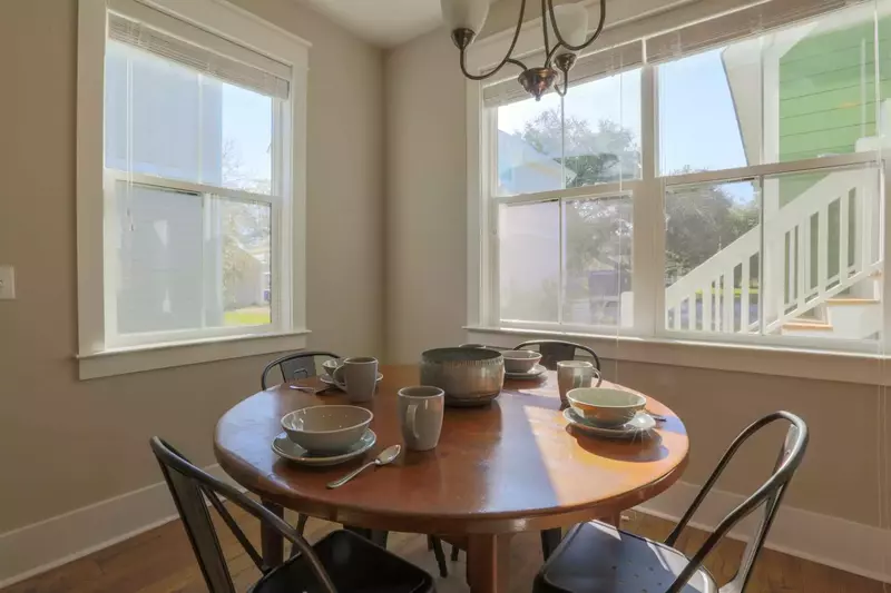 The dining table in the kitchen comfortably seats 4 people.