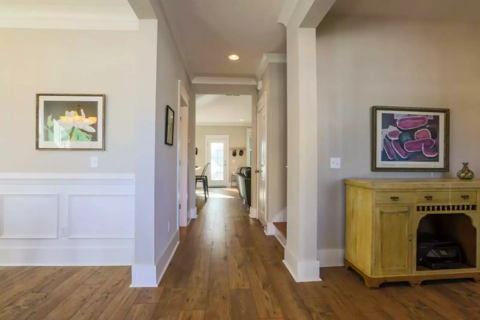 The front door opens on to a central hallway that leads to the kitchen and living room.