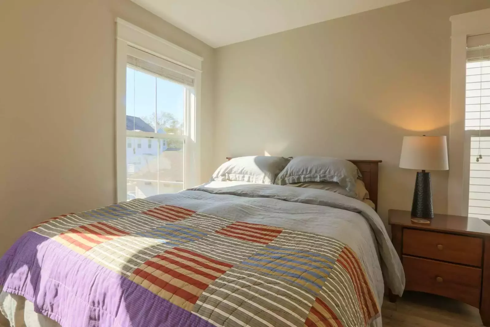The two guest bedrooms on the second floor of the home overlook the backyard.