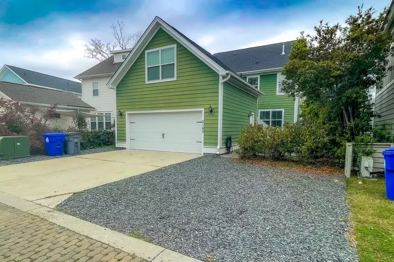 You may park two cars on the gravel behind the home.