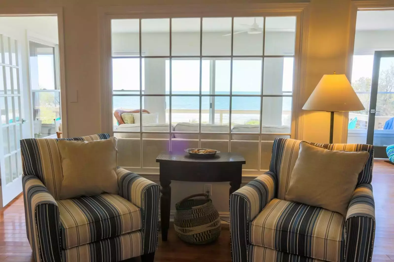 The large window between the family & living rooms provide open views of the ocean from the family room.