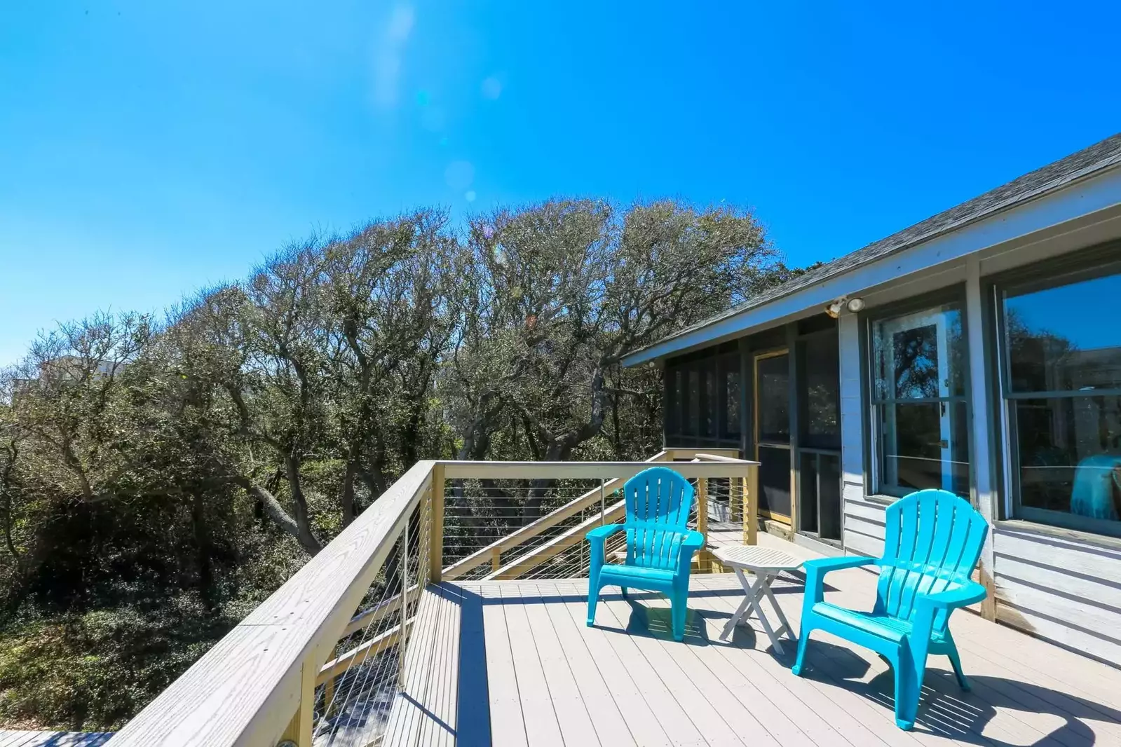 Exterior stairs lead from the Salt Sea deck through the backyard to the home's private walkway to the beach.