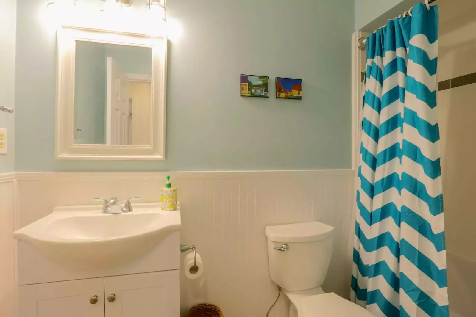 This bathroom, which is located off the hallway near 2 guest bedrooms, has a combined tub & shower.