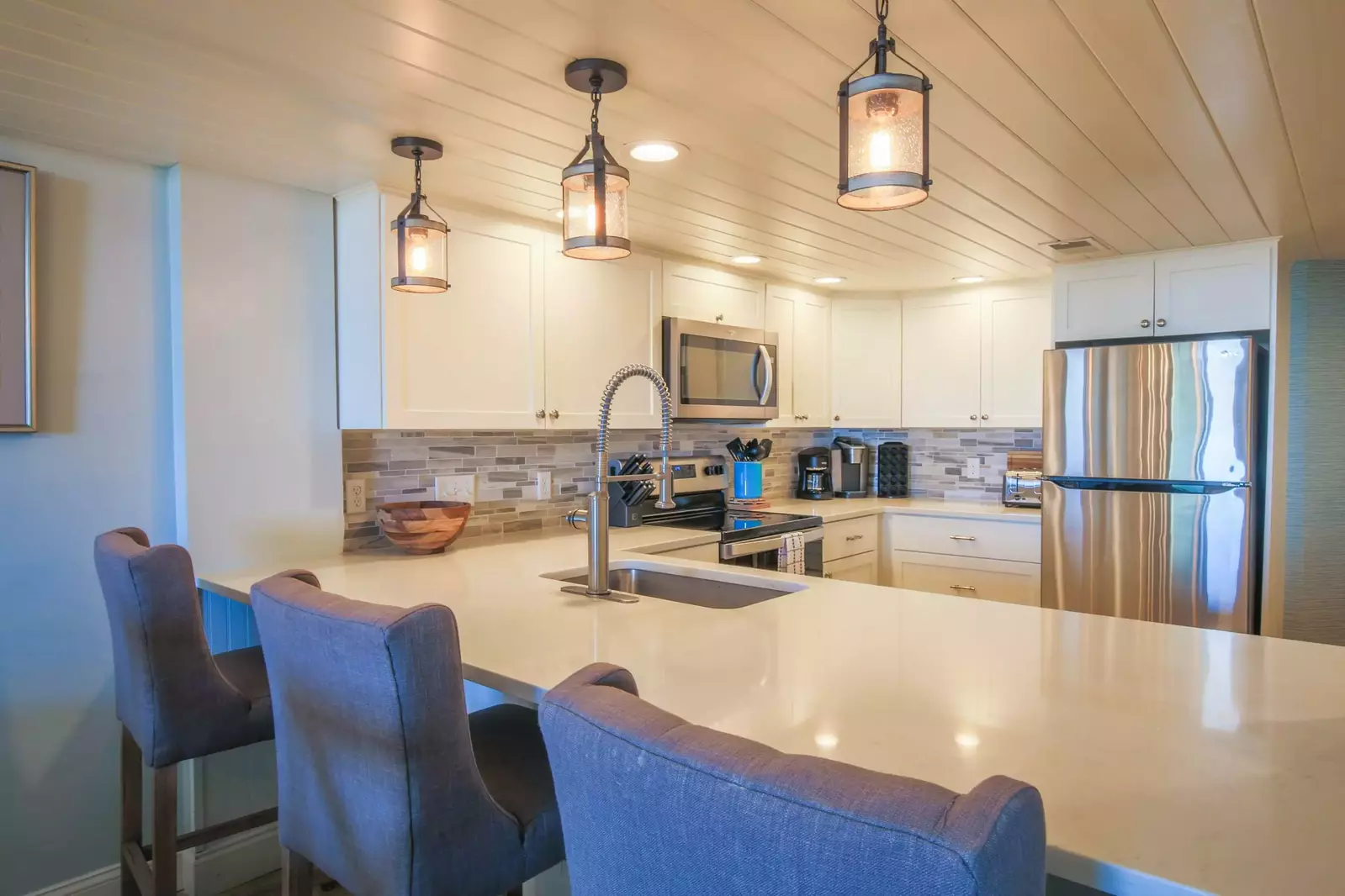 There are 3 stools for additional seating at the kitchen counter.