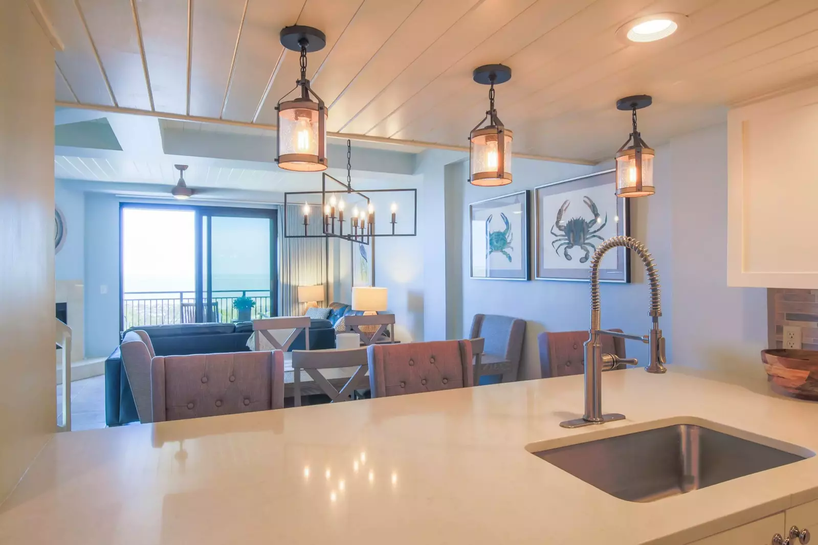 The open floor plan layout makes it very easy to interact with guests in the kitchen, dining & living room areas.